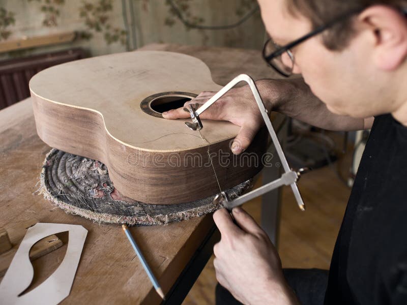 The Process of Making a Cutaway on Classical Guitar. Stock Image