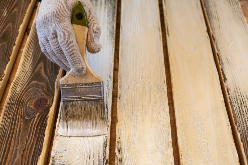 Process of Painting the Pine Wood Boards with the Brush and the White Paint Stock Photo Image