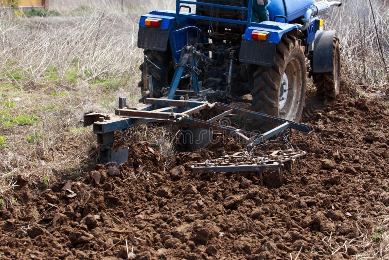 Process of plowing land stock photo. Image of machinery 189025362