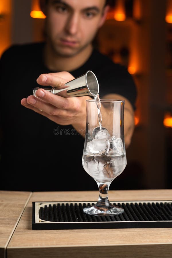 Process of Preparing a Cocktail Bartender S in Bar. Stock Photo Image