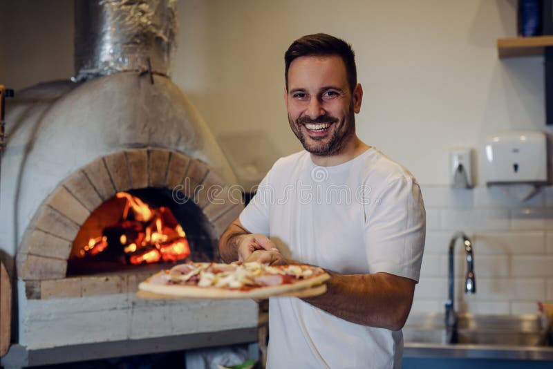 A Process of Preparing Pizza by a Chef.Italian Traditional Pizza is