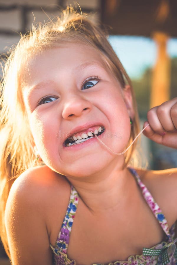 The Process of Removing a Baby Tooth Using a Thread Stock Image Image