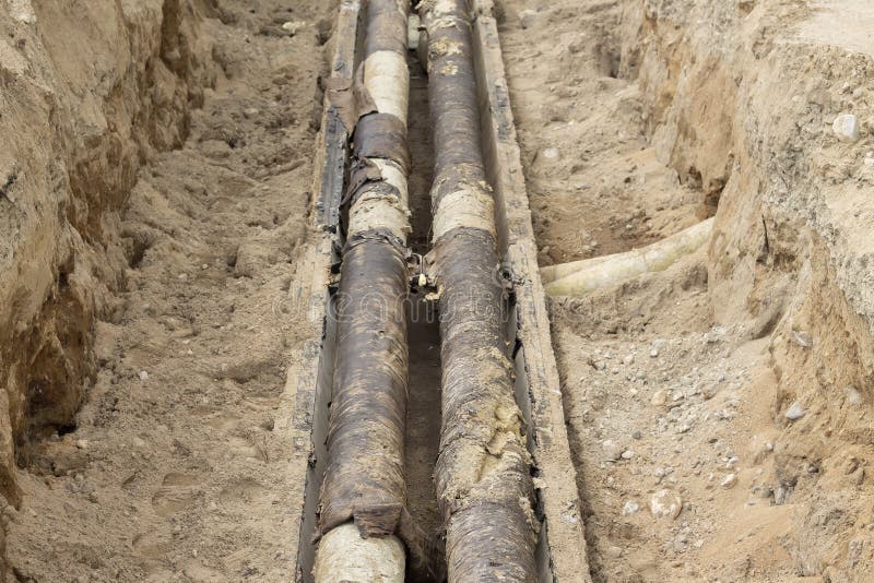 Repair of the Heating Main. the Underground Pipe through Which Steam