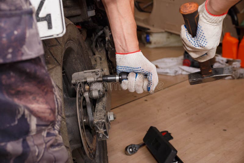 The Process of Replacing Brake Pads on a Motorcycle Stock Photo Image