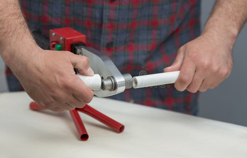The Process of Soldering Plastic Pipes. Stock Photo Image of plumber, pipeline 220540778