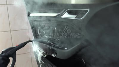 Premium Photo  Process of steam cleaning inside handle of car