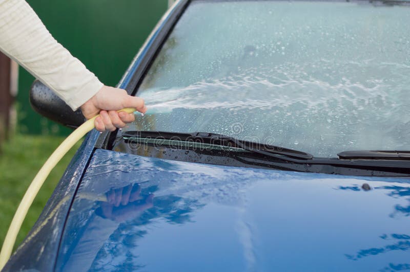 The Process of Washing and Wiping Cars with the Help of a Cloth Stock