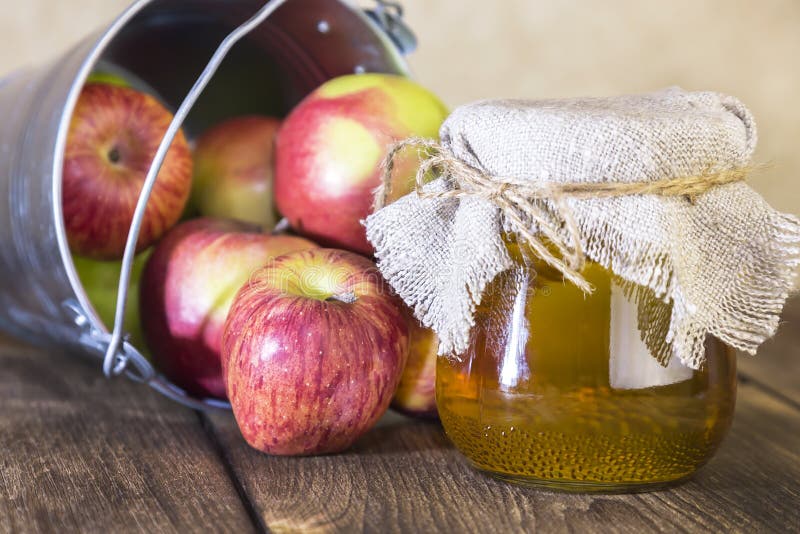 Processing of an agricultural crop of red and green apples. Home canning, healthy diet vegetarian food. Apple cider vinegar, juice