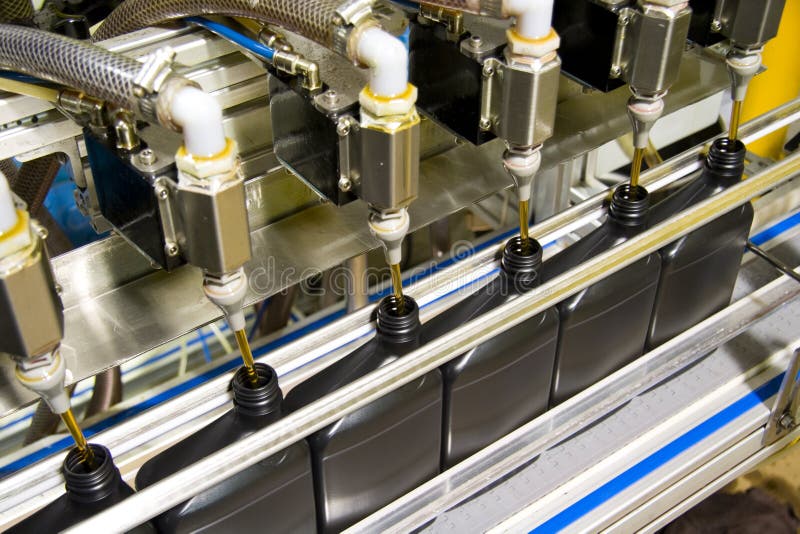 Oil is dispensed into quart bottles at a lubricant manufacturing facility. Oil is dispensed into quart bottles at a lubricant manufacturing facility