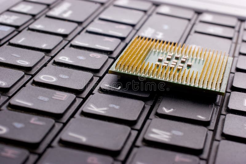 Processor chip on computer keyboard stock photos