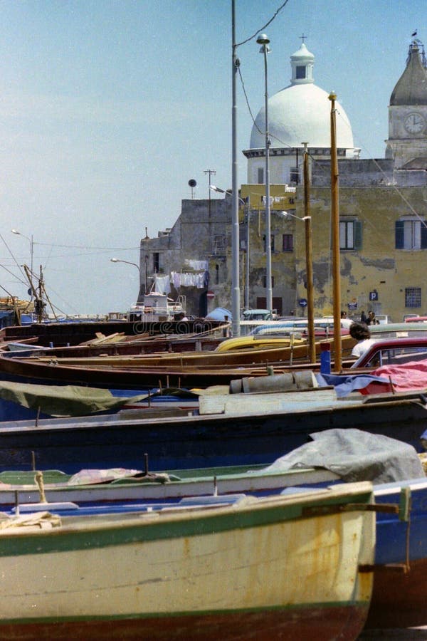 PROCIDA, ITALY, 1970 -The dome of the Church of S. Maria della Pietà and St. Giovanni Battista dominates the dry boats royalty free stock image PROCIDA, ITALY, 1970 -The dome of the Church of S. Maria della Pietà and St. Giovanni Battista dominates the dry boats royalty free stock image