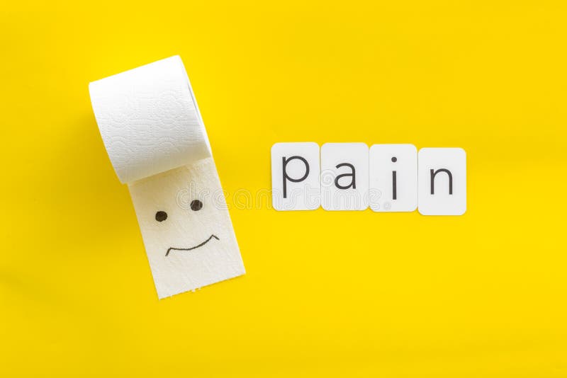 Disease of colon concept with toilet paper roll and pain copy on yellow background top view royalty free stock photography Disease of colon concept with toilet paper roll and pain copy on yellow background top view royalty free stock photography