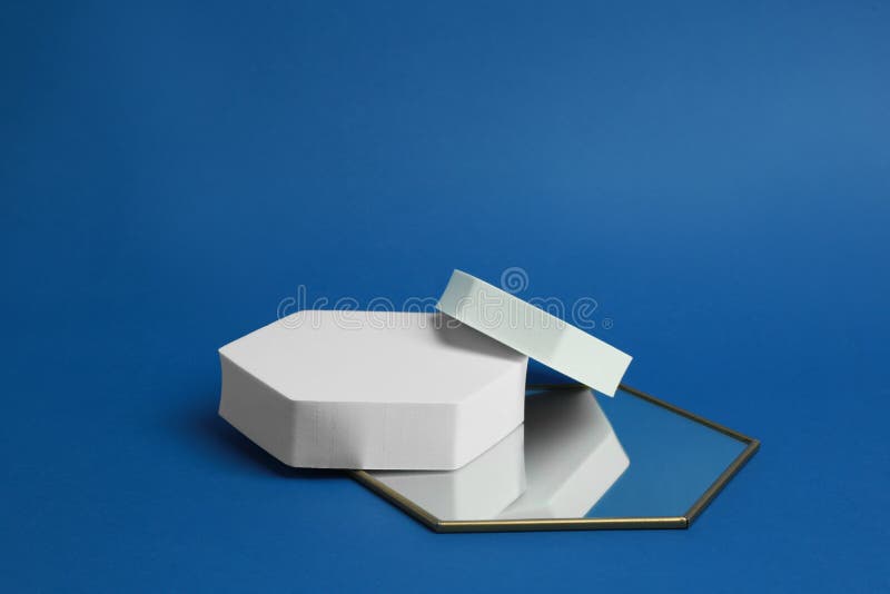 Product Photography Props. Hexagonal Shaped Podiums and Mirror on Blue