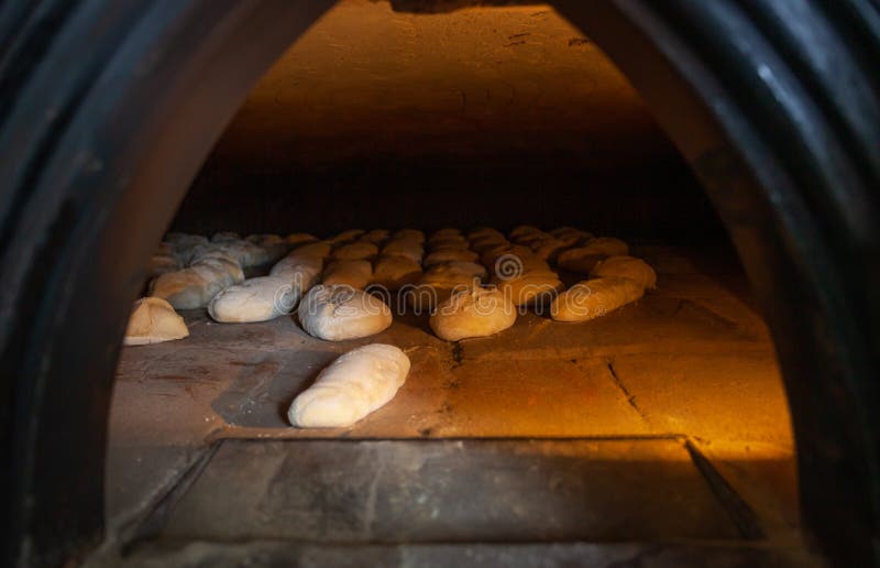 Production of Baked Bread with a Wood Oven in a Bakery Stock Photo