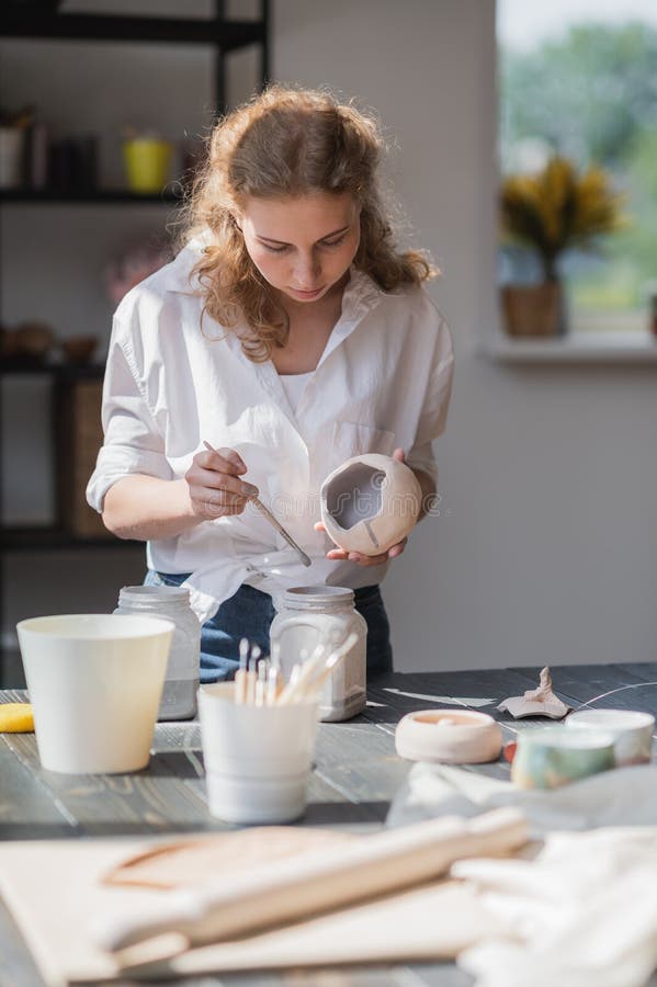 Production Process of Pottery. Application of Glaze Brush on Ceramic