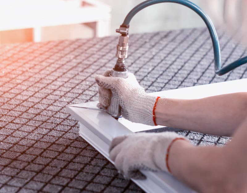 Production of pvc windows, stripping corners in a pvc frame, close-up, sweeping stock photos Production of pvc windows, stripping corners in a pvc frame, close-up, sweeping stock photos