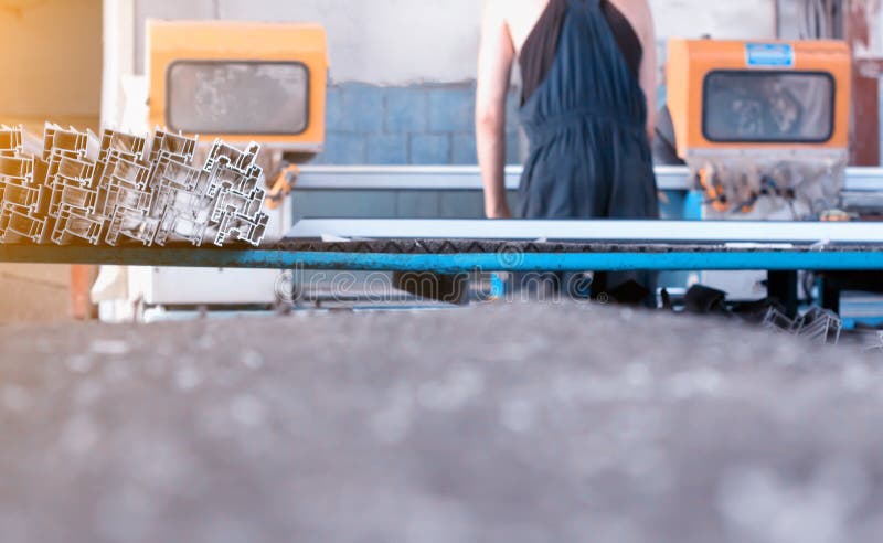 Production of pvc windows, the worker produces the assembly of PVC windows, plastic profile, machine royalty free stock images