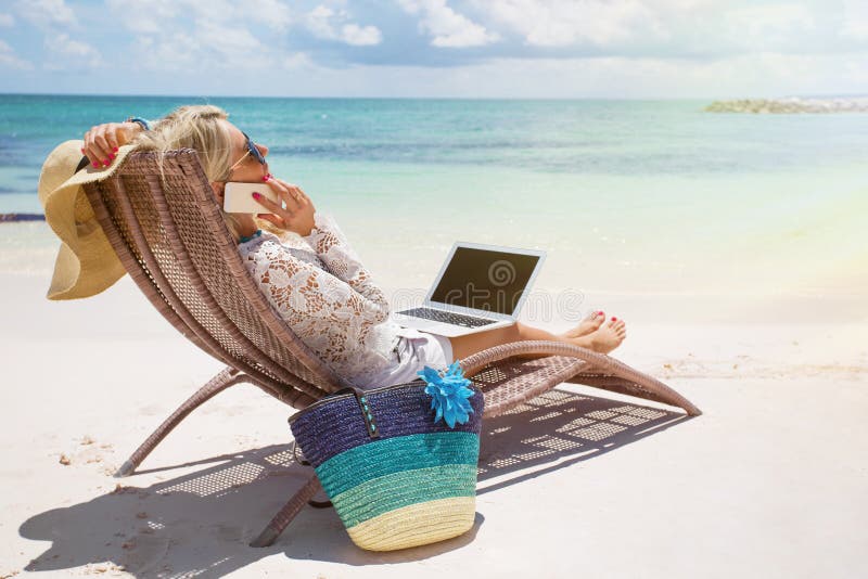Productive businesswoman working on the beach royalty free stock photo Productive businesswoman working on the beach royalty free stock photo