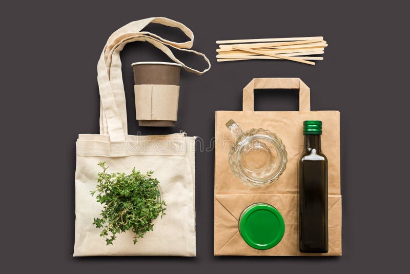 Eco-friendly products. Cotton, paper shopping bag, jar and bottle on a cotton background. Life Without Plastic. Eco-friendly products. Cotton, paper shopping bag, jar and bottle on a cotton background. Life Without Plastic