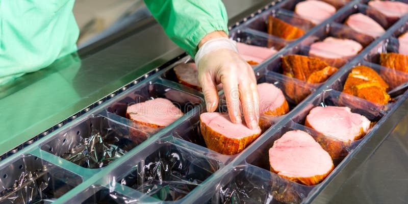 Several chunks of raw meat being processed packaged and shipped. Several chunks of raw meat being processed packaged and shipped