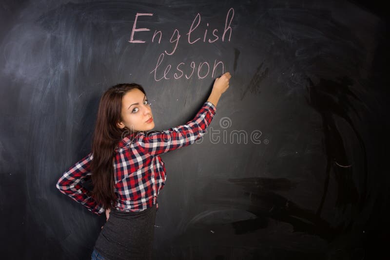 Professeur féminin attirant donnant une leçon anglaise photos stock Professeur féminin attirant donnant une leçon anglaise photos stock