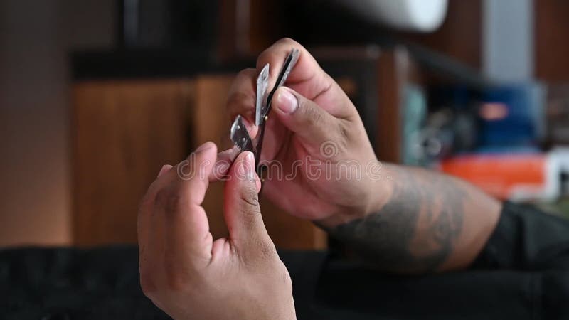 Professional barber scissors trimming hair stock video footage