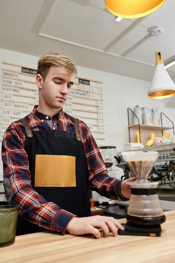 Professional Barista Man Making Coffee at the Coffee Shop. Stock Image