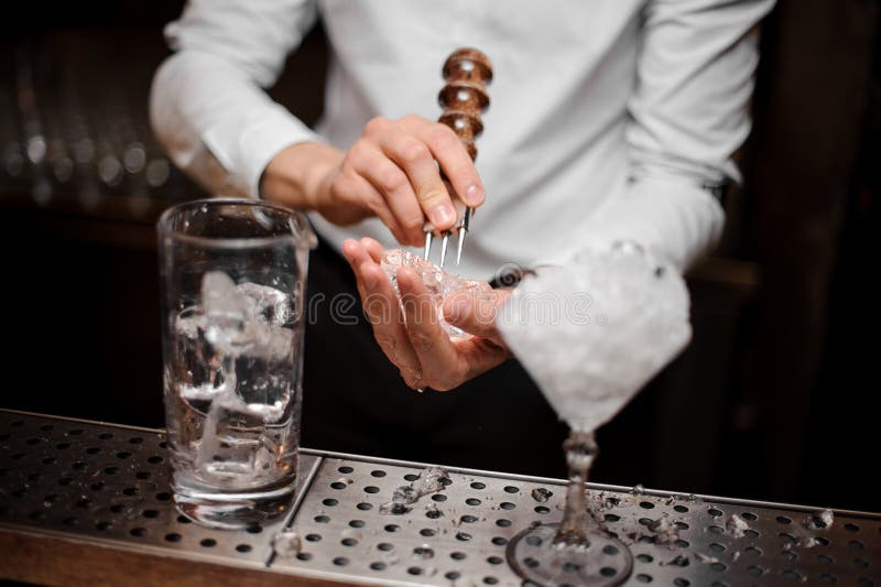 Professional Bartender Breaking an Ice Cube with the Special Tool Stock Image Image of