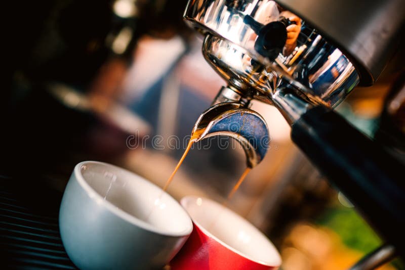 Professional brewing - coffee bar details. Espresso details coffee pouring from espresso machine. Barista details in cafe shop royalty free stock photos Professional brewing - coffee bar details. Espresso details coffee pouring from espresso machine. Barista details in cafe shop royalty free stock photos