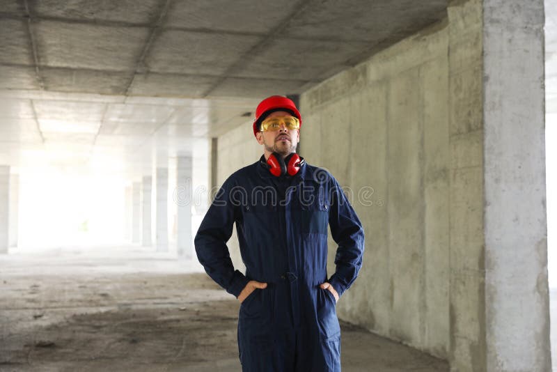 Professional builder in safety equipment stock images