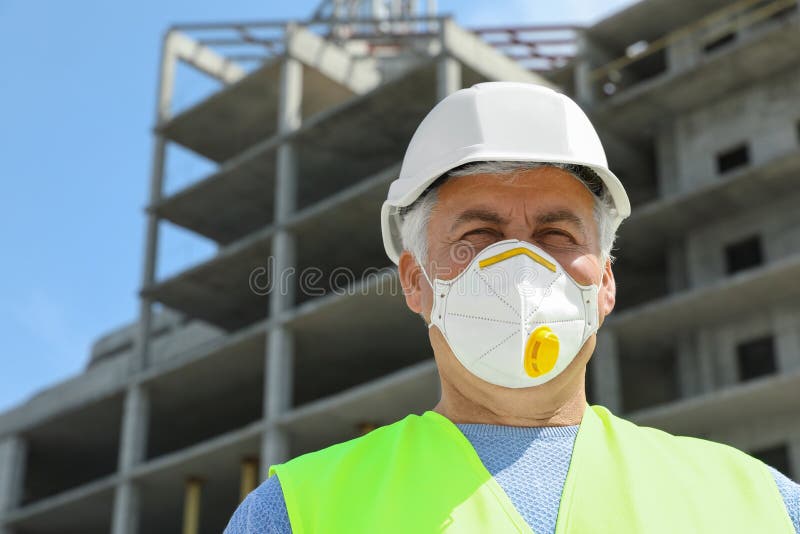 Professional Builder in Safety Equipment at Construction Site, Space
