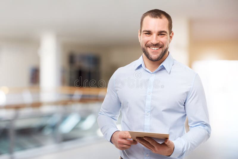 Business man in the business center with tablet computer