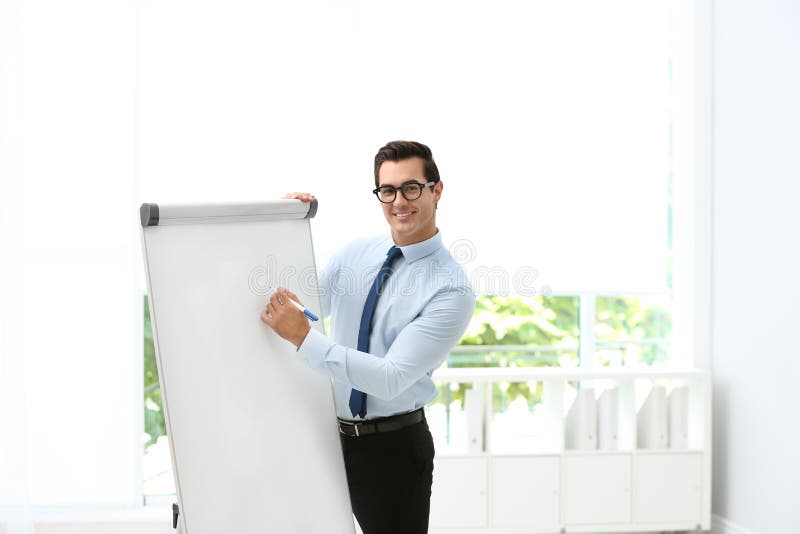 Professional Business Trainer Near Flip Chart in Stock Photo Image of
