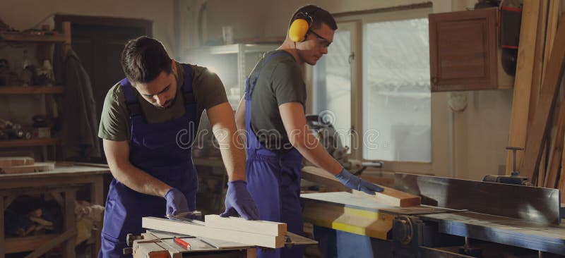 Professional carpenters working with wood in shop. Banner design royalty free stock images