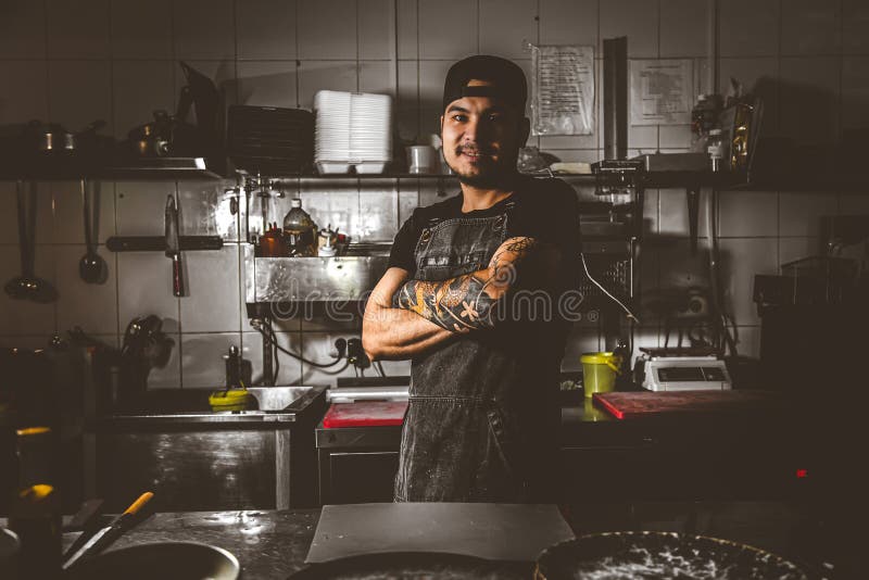 Professional Chef Stands in the Kitchen Restaurant Stock Photo Image