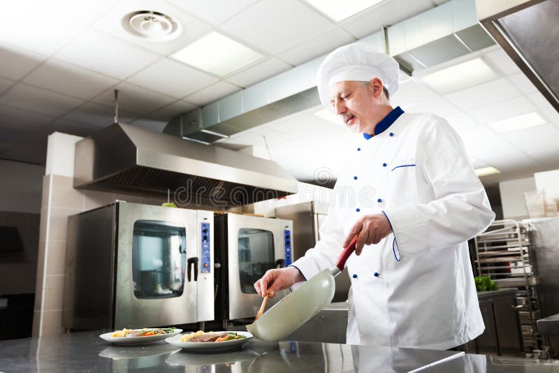 Professional chef at work stock photo Professional chef at work stock photo