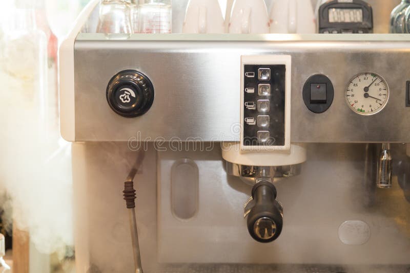 Professional Coffee Machine Maker with Smoke on Coffee Shop. Stock