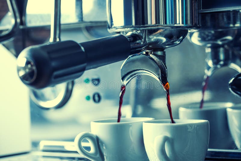 Professional coffee machine making espresso in a Two cafe.