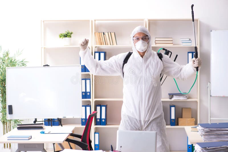 The Professional Contractor Doing Pest Control at Office Stock Image