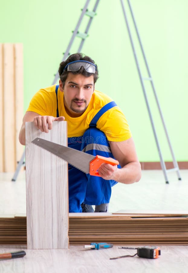 Professional Contractor Laying Flooring at Home Stock Image Image of