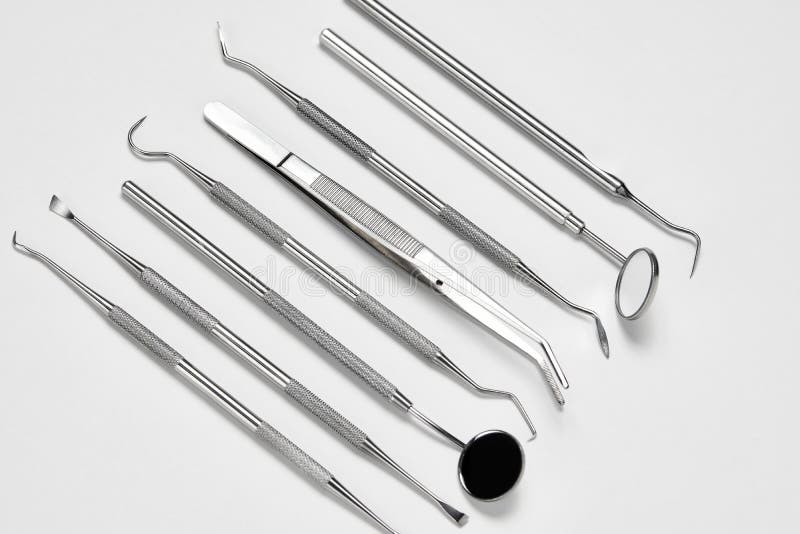 Professional Dentist Tools on White Background with Copy Space Stock