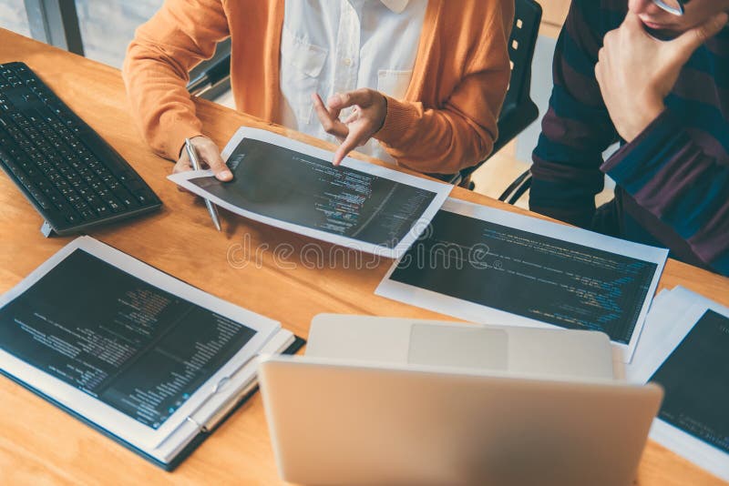 Professional Development programmer cooperating meeting and brainstorming and programming website working in a software and coding technology, writing codes and data code. Program coding working stock images, royalty-free photos and pictures