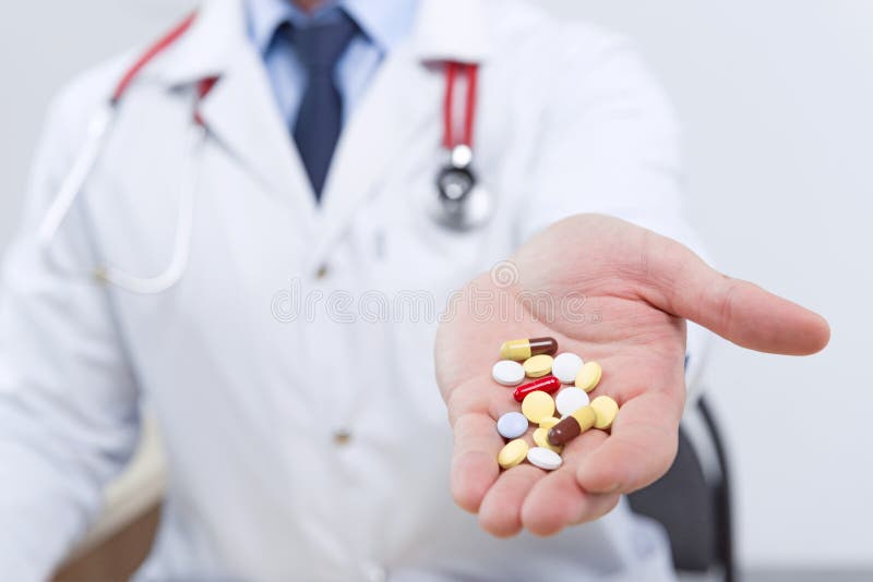 Professional Doctor Giving Pills Stock Photo - Image of adult, cardio ...