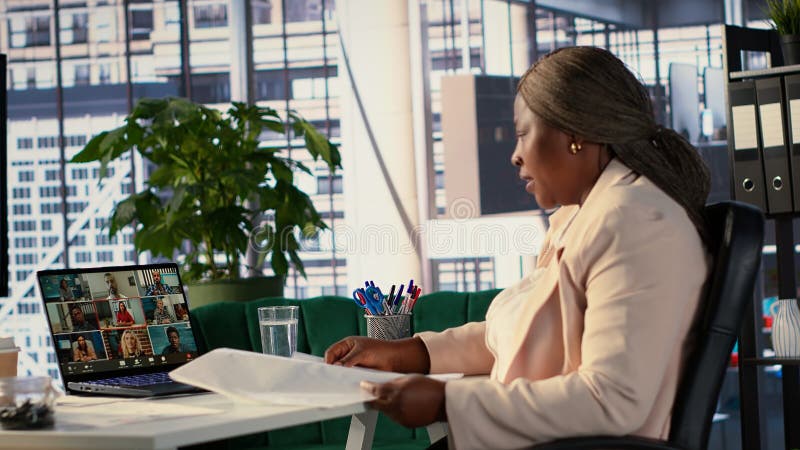 Professional driven CEO sharing data insight on videocall with investors stock photo