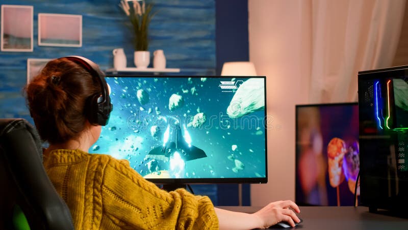 Back of pro gamer playing first person shooter video game on professional  computer for cyber esport competition. Pro player talking with multiple  players using headset during online tournament Stock Photo - Alamy