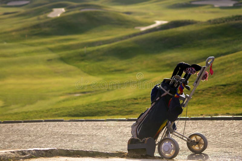 Golf gear, clubs at sunset stock photo. Image of leisure 16635766
