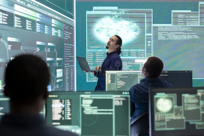 Professional hacker using ransomware and phishing tactics to compromise networks stock photos