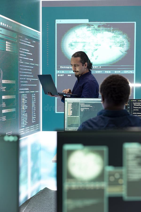 Professional hacker using ransomware and phishing tactics to compromise networks stock photography