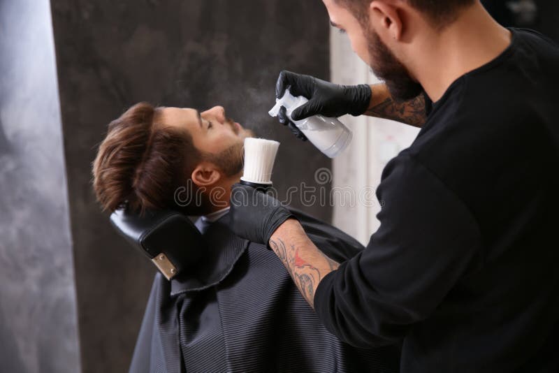 Professional Hairdresser Using Talcum Powder To Calm Client`s Skin after  Shaving Stock Photo - Image of applying, clients: 145023728