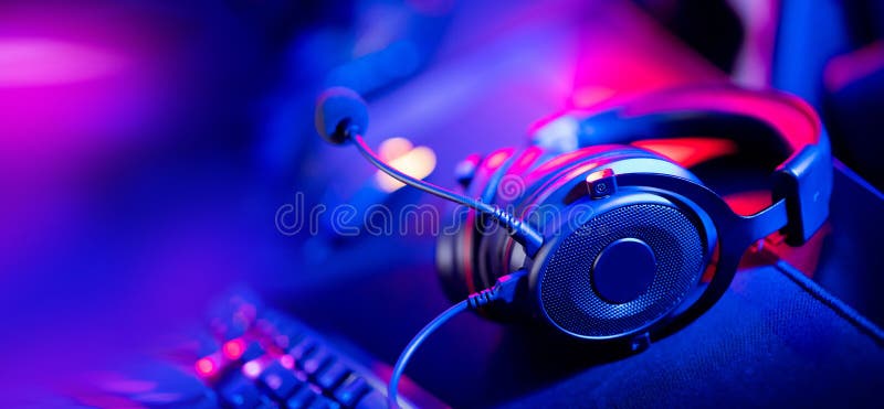 Professional Headphones with Microphone for Video Games and Cyber Sports on  Background of Gaming Monitor Stock Image - Image of headphones, background:  222756817